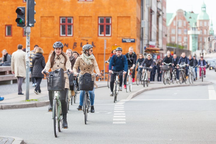 People commuting by bike in Copenhagen, Denmark. Some cities are already well set up for cleaner transportation options such as cycling.