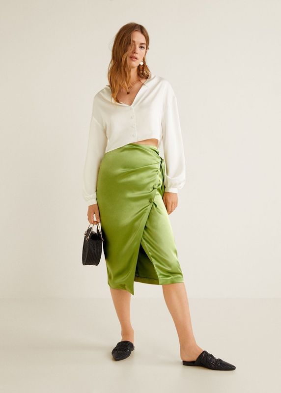 Bow Satin Skirt, sizes XS-L available, &pound;35.99, <a href="https://shop.mango.com/gb/women/skirts-midi/bow-satin-skirt_33031085.html?c=43&amp;n=1&amp;s=prendas.familia;20.skirts20;Midi\" target="_blank" rel="noopener noreferrer">Mango</a>.