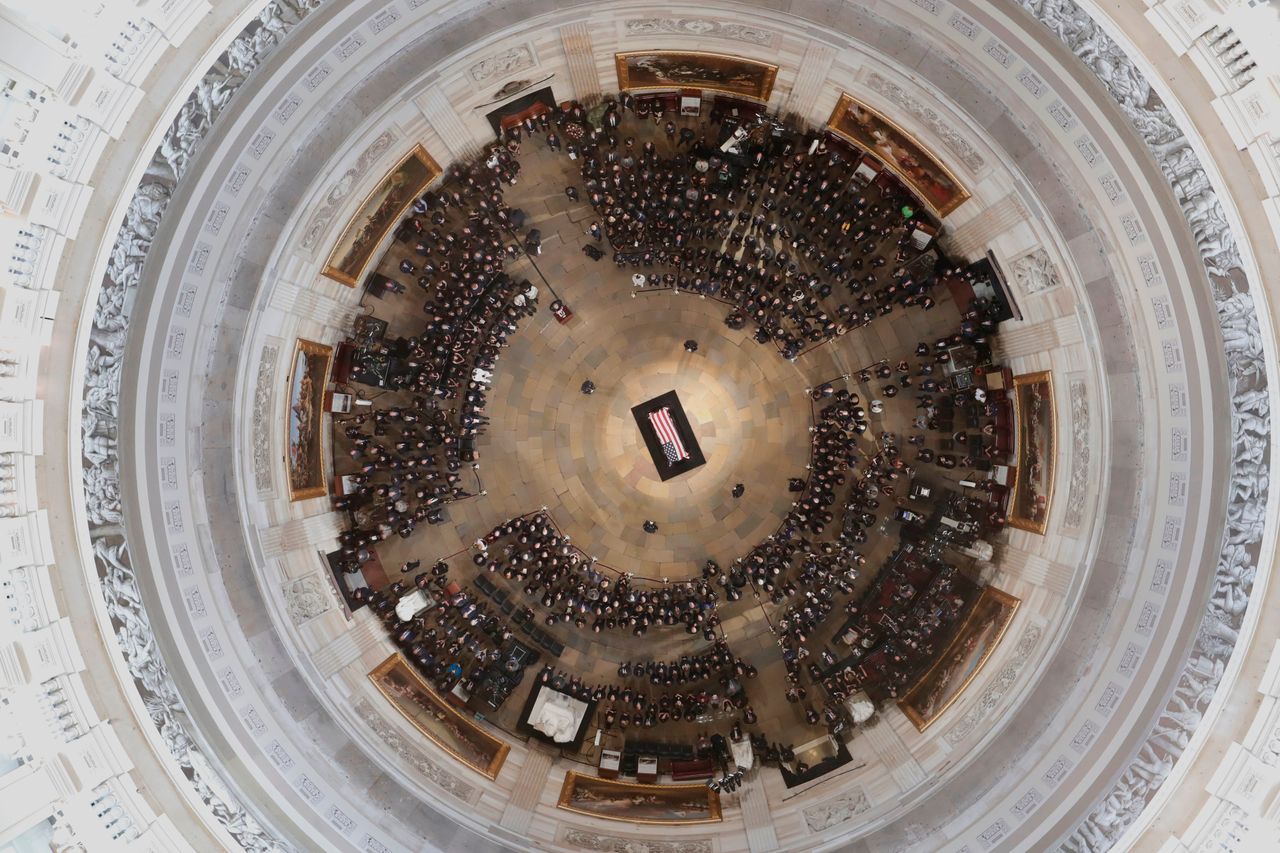 The casket of Sen. John McCain lies in state at the Capitol rotunda.