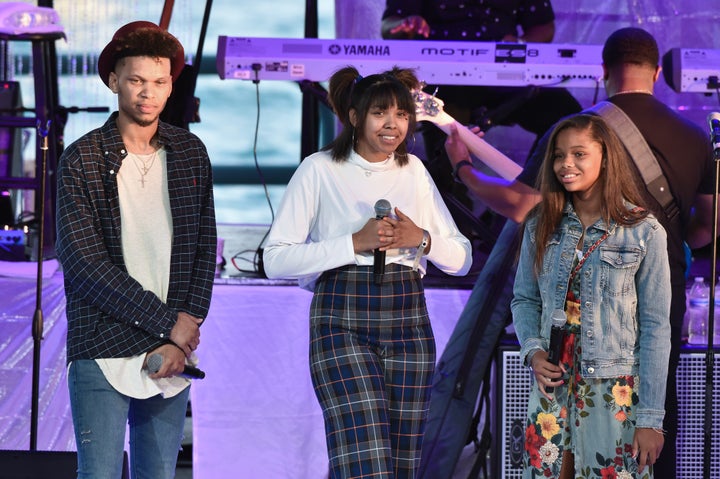 Aretha Franklin's grandchildren Jordan, Gracie and Victorie speak onstage at an Aug. 30 tribute concert at Chene Park —