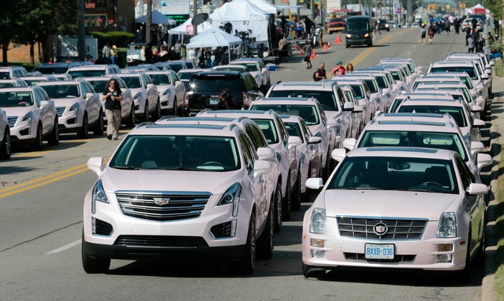 Pink Cadillacs line Seven Mile Road in front of Aretha Franklin's funeral at the Greater Grace Temple.