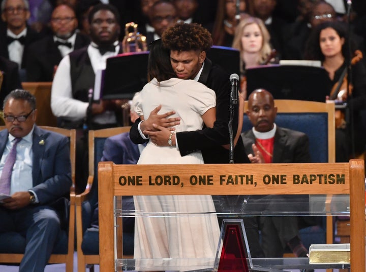 Aretha Franklin's grandchildren Jordan and Victorie Franklin embrace.