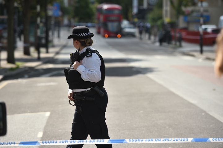 A police officer stands on the Caledonian Road in Islington, north London