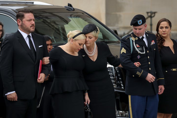 Meghan McCain and her mother Cindy McCain embrace as the casket of the late Senator John McCain arrives at the Washington National Cathedral.