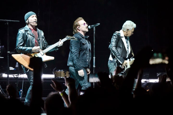 The Edge, Bono and Adam Clayton of the Irish band U2 performing in Berlin on Friday night.