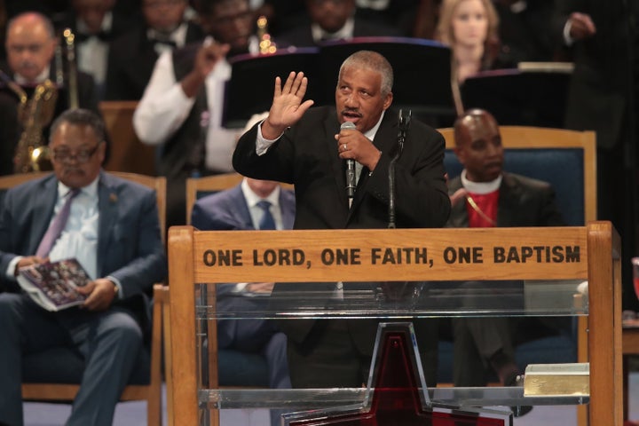 Edward Franklin, one of Franklin's four sons, sings at her funeral service on Friday in Detroit.