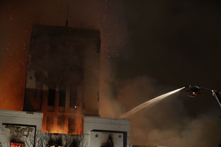 A fire platform attempts to dampen flames at Liverpool's iconic Littlewoods Pools building on Sunday night.