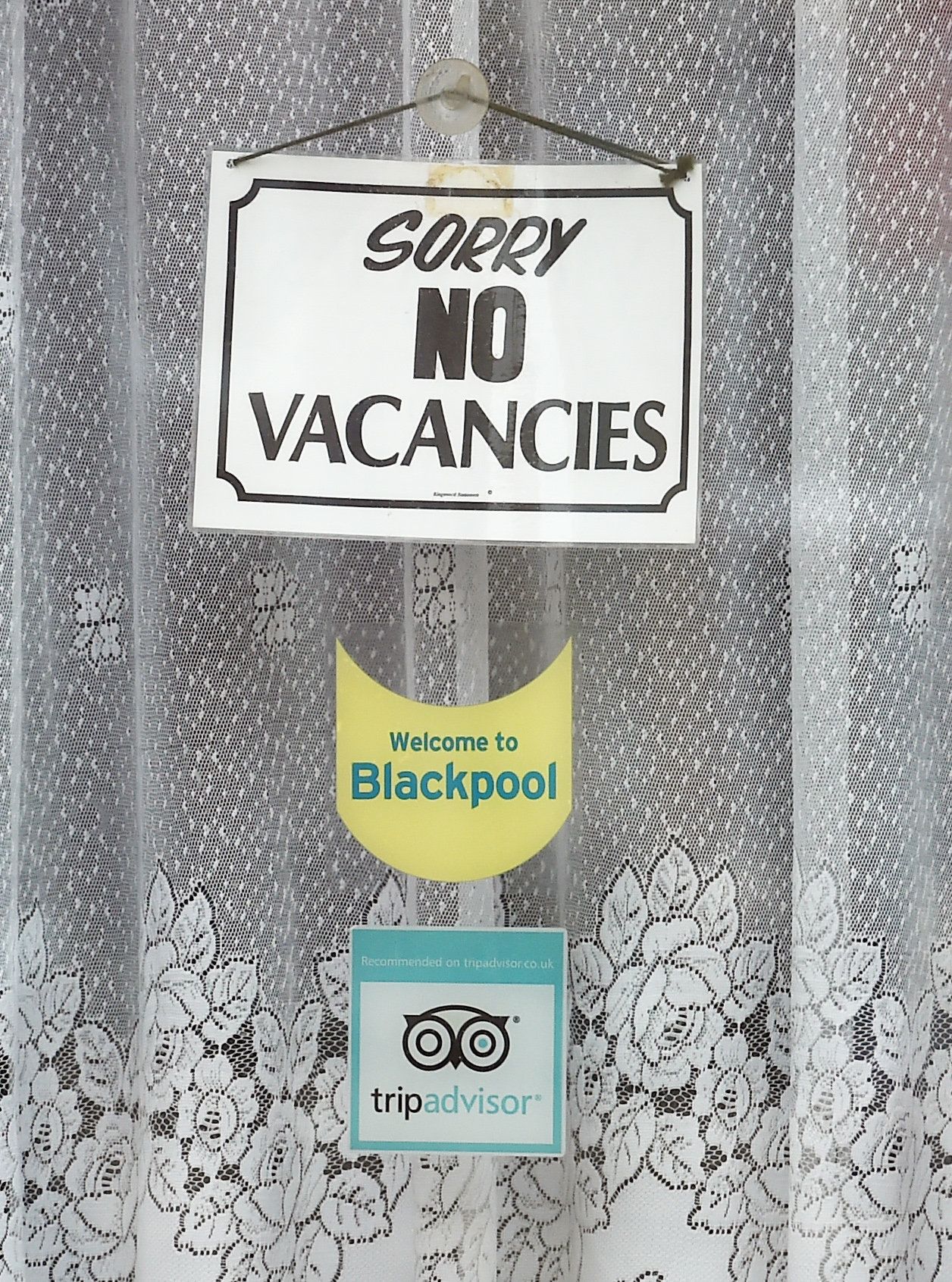 A vacancy sign is seen in the window of a Bed and Breakfast guest house in Blackpool.
