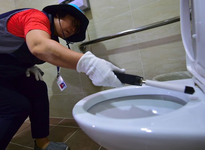 A government employee carrying out a toilet check in August 2016