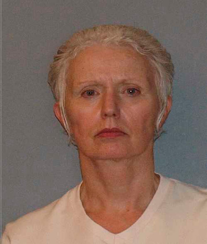 Greig in a booking photo released after her arrest in 2011. She was convicted of conspiracy to harbor a fugitive and criminal