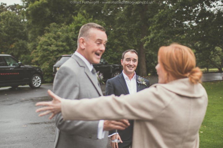 “She just strode right up to them with the biggest smile and gave them both a big squeeze and wished them every health and happiness,” photographer Matt Fothergill said of Rowling. 