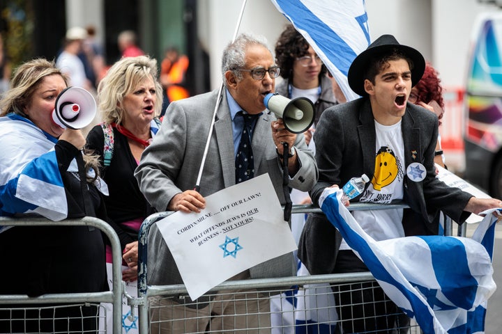 Protestors demonstrate outside the NEC