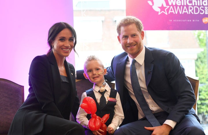 Prince Harry and Meghan Markle meet four-year-old Mckenzie Brackley at the WellChild Awards on Sept 4.