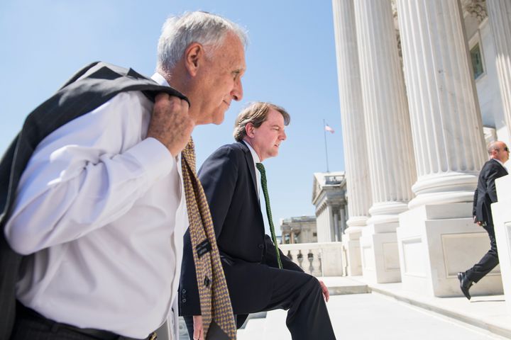 Former Sen. Jon Kyl (R-Ariz.), left, seen on July 10 as he escorts Supreme Court nominee Brett Kavanaugh and Vice President Mike Pence to meetings with senators.