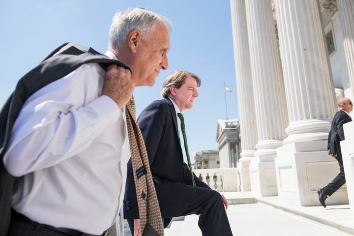 Former Sen. Jon Kyl (R-Ariz.), left, seen on July 10 as he escorts Supreme Court nominee Brett Kavanaugh and Vice President M