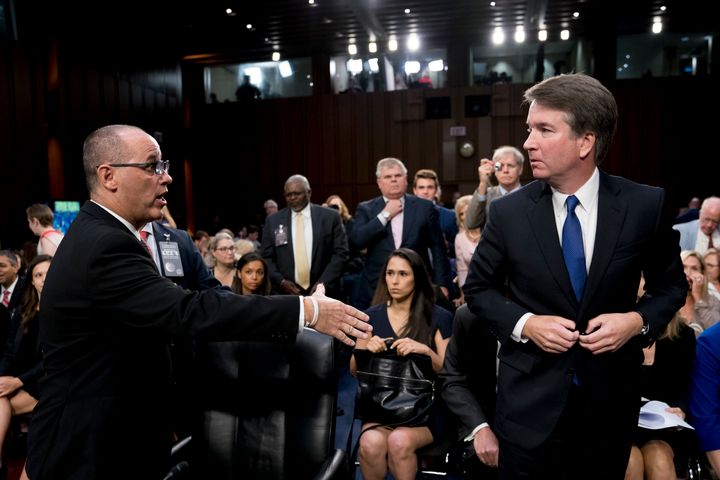 Fred Guttenberg, whose daughter Jaime was killed in a mass shooting in Parkland, Florida, in February, attempts to shake hands with Brett Kavanaugh, President Donald Trump's Supreme Court nominee, on Tuesday.