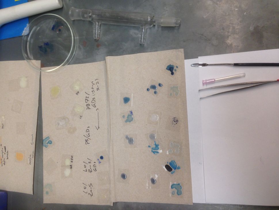 A sample of in-progress pigments being examined in the laboratory. A small sample of Quantum Blue.