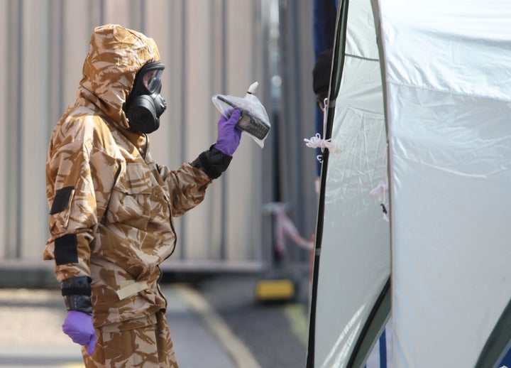 <strong>An investigator in a chemical suit in Salisbury, Wiltshire </strong>