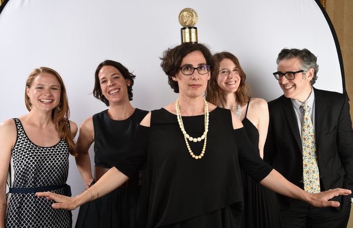 The team behind "Serial," led by Sarah Koenig (center), with "This American Life" host Ira Glass (right), posing with their Peabody Award in 2015.