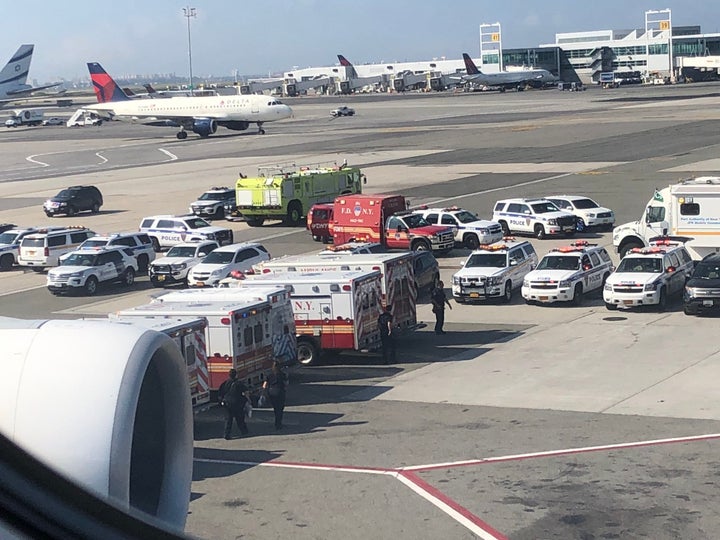 A photo reportedly taken by a passenger onboard the flight at JFK Airport shows a number of emergency vehicles outside.