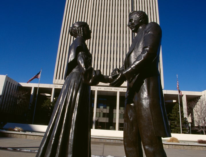 Statues of Joseph Smith and his wife Emma stand in front of the headquarters of The Church of Jesus Christ of Latter-day Sain