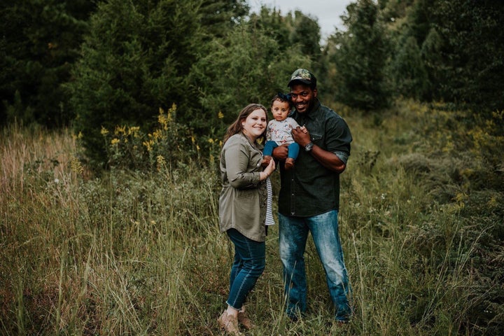 Jennifer and Tyrelle with their 19-month-old daughter. 