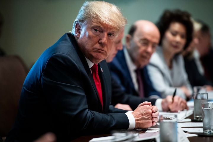 President Donald Trump listens during a Cabinet meeting at the White House on Aug. 16.