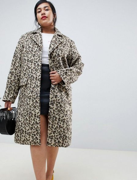 in a cheetah print coat