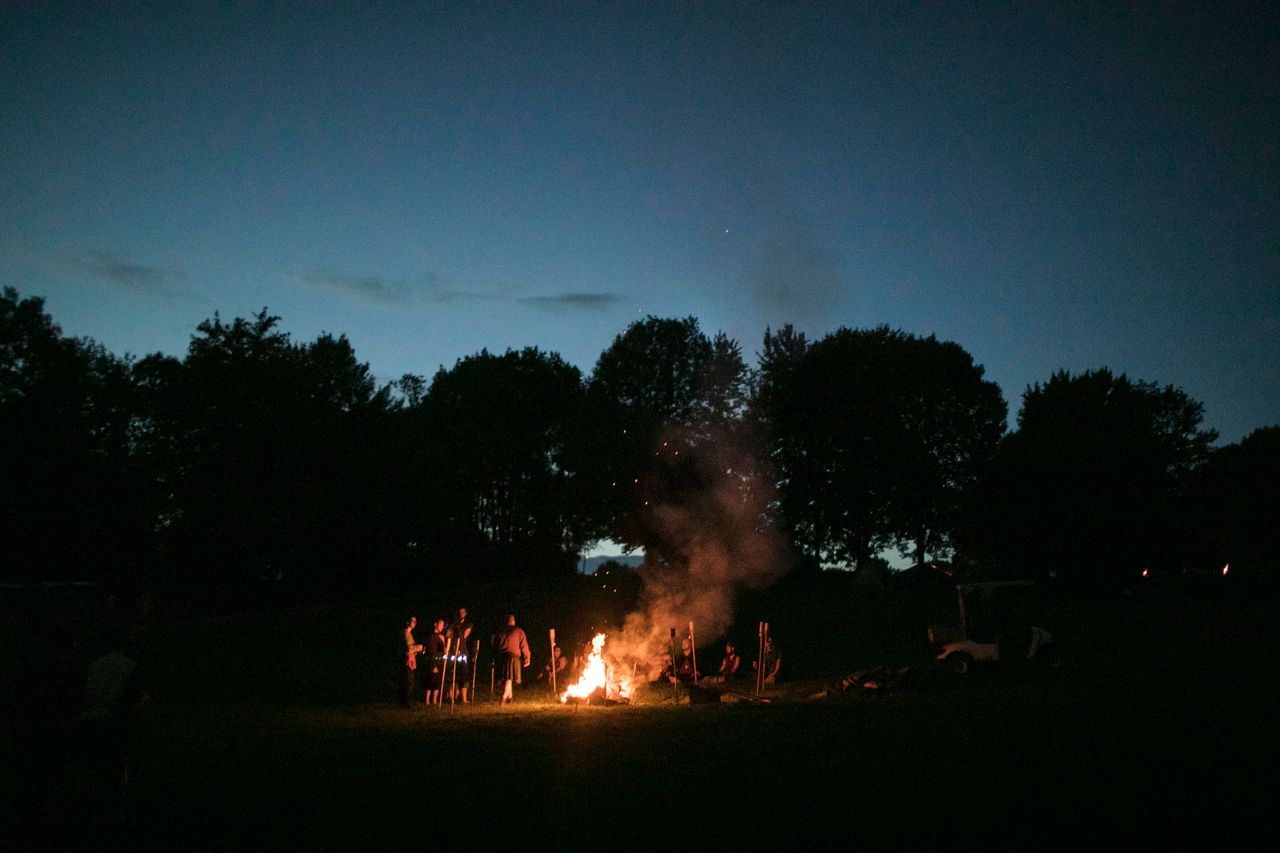 A bonfire rages after dark at Ragnarok. 