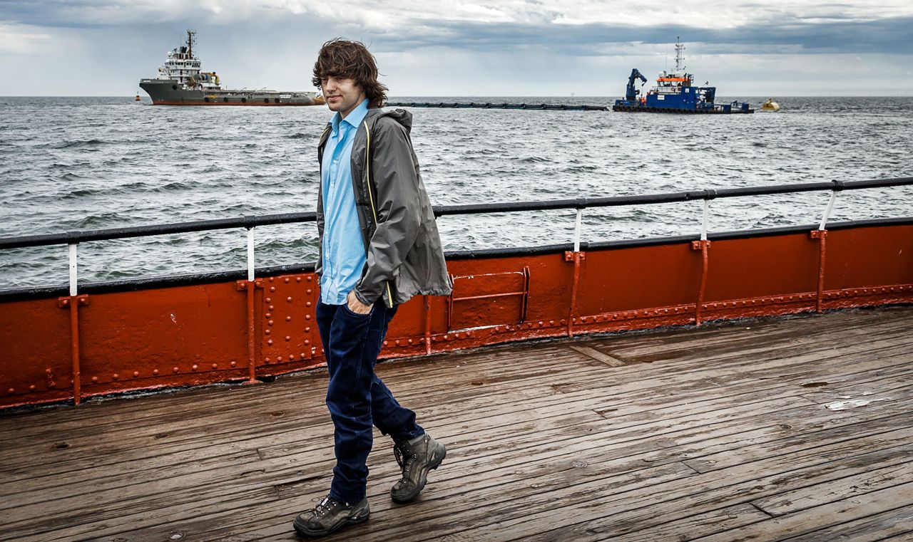 Boyan Slat in front of a prototype of the Ocean Cleanup off the Netherlands in June 2016.