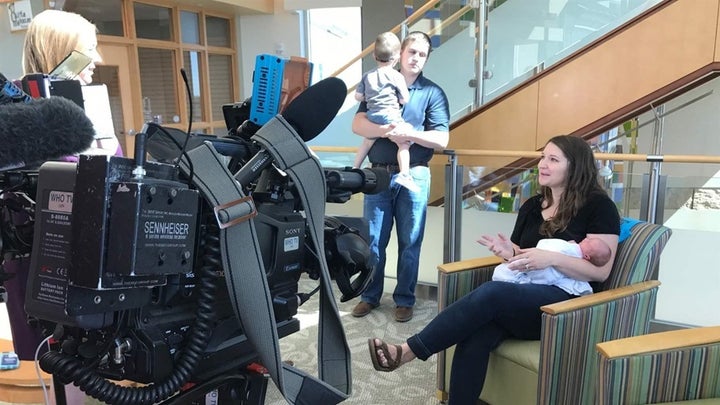 An Iowa TV station interviews Emily Eekhoff of Ankeny, Iowa, in 2017, soon after her daughter Ruby was born. Eekhoff said that “counting the kicks” in Ruby’s third trimester led her to alert her doctor to the baby’s distress and an emergency C-section that saved Ruby’s life. Her husband, Jeremy, holds their son, Liam. 