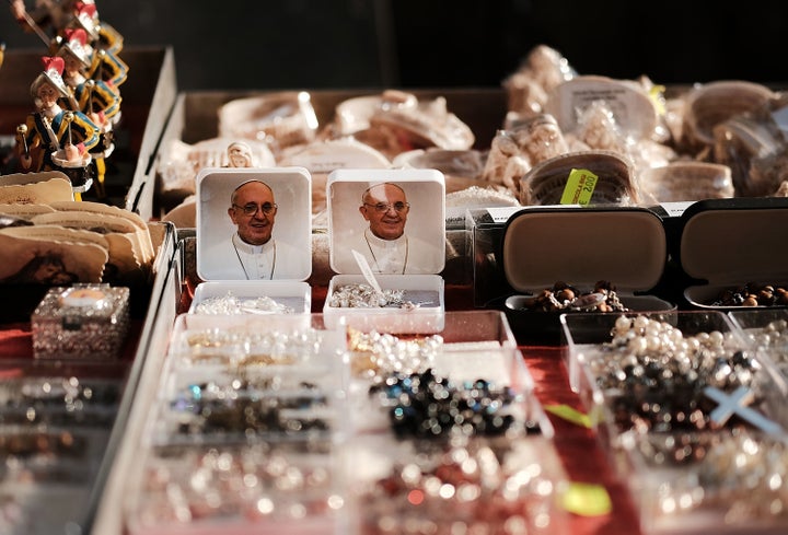A vendor sells Pope Francis magnets and other items outside of St. Peter's Basilica on August 31, 2018 in Vatican City, Vatic