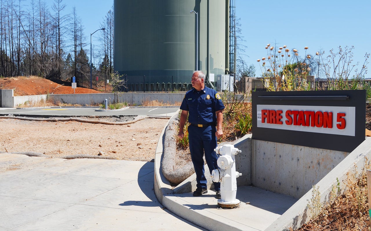 A Santa Rosa fire station was among the many buildings destroyed during the Northern California “firestorm" last October. Santa Rosa Fire Chief Tony Gossner is pictured here in front of the empty lot.