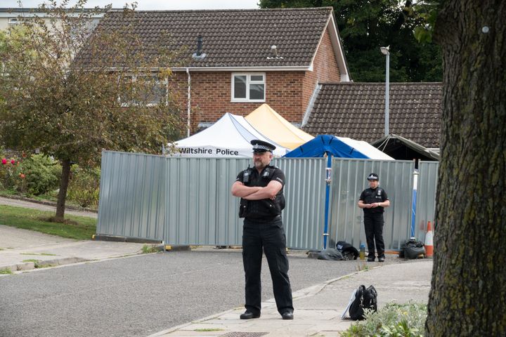 Police stand outside the home of former Russian spy Sergei Skripal 
