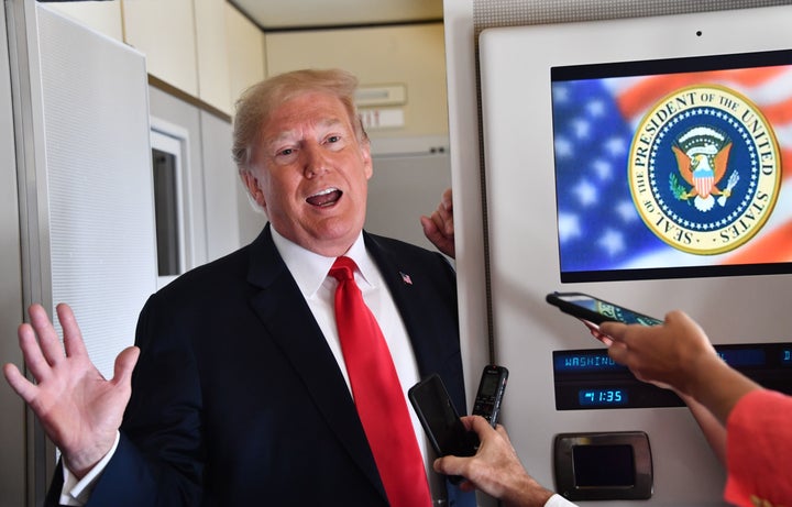 President Donald Trump speaks to the press aboard Air Force One on Sept. 7, 2018, as he travels to Fargo, North Dakota.