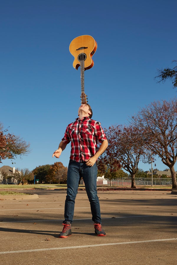 Josh Horton balanced a guitar on his noggin for 7 minutes, 3.9 seconds.&nbsp;