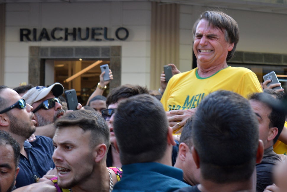 Bolsonaro was riding on the shoulders of supporters when his attacker stabbed him in the abdomen, sending the presidential candidate into emergency surgery. 