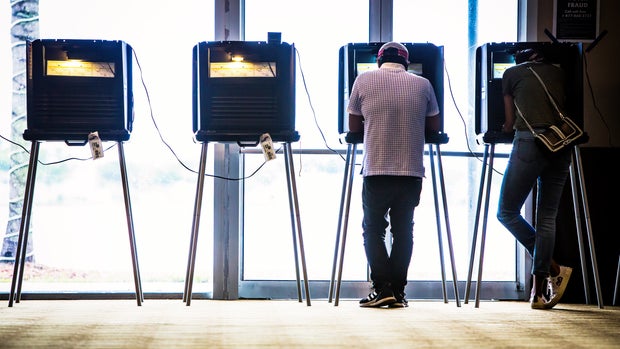 Voters cast ballots at a polling station in Doral, Florida, U.S., on Tuesday, Aug. 28, 2018. The Senate contest in Florida is all but set between three-term Senator Bill Nelson, a Democrat, and the state's two-term Governor Rick Scott, a Republican. The race will be one of the most competitive and expensive in the country. Photographer: Scott McIntyre/Bloomberg via Getty Images