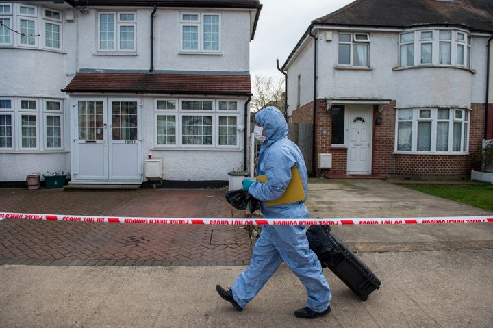 A forensics officer attending the scene where Glushkov was found dead in March