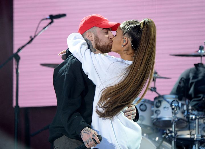 Miller and Grande kiss on stage during the One Love Manchester Benefit Concert in June 2017.