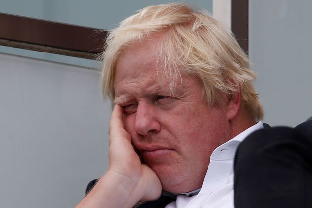 Britain's former foreign secretary Boris Johnson sits in the stands during play on the second day of the fifth Test cricket match between England and India at The Oval in London.