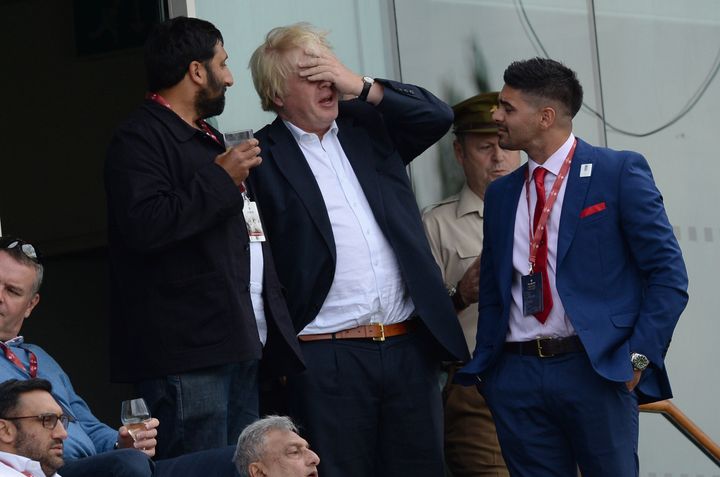The politician was immediately spotted by commentators as he stood with friends in the stands on Saturday.