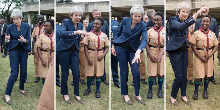 A composite picture of Prime Minister Theresa May breaking into dance whilst meeting with scouts at the United Nations offices in Nairobi on the third day of her visit to Africa.