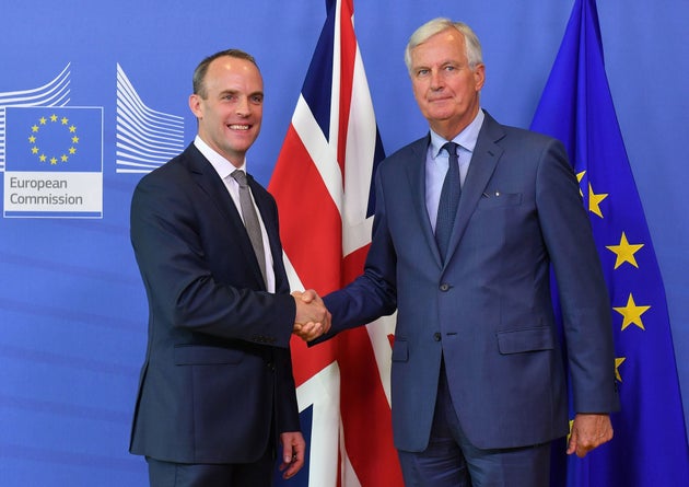 EU Chief Brexit Negotiator Michel Barnier (R) shakes hands with Britain's Brexit Secretary Dominic Raab during their meeting at the European Commission in Brussels on August 31, 2018