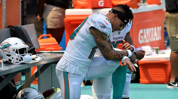 Sep 9, 2018; Miami Gardens, FL, USA; Miami Dolphins wide receiver Kenny Stills (left) and Dolphins wide receiver Albert Wilson (right) both kneel during the national anthem prior to a game against the Tennessee Titans at Hard Rock Stadium. Mandatory Credit: Steve Mitchell-USA TODAY Sports