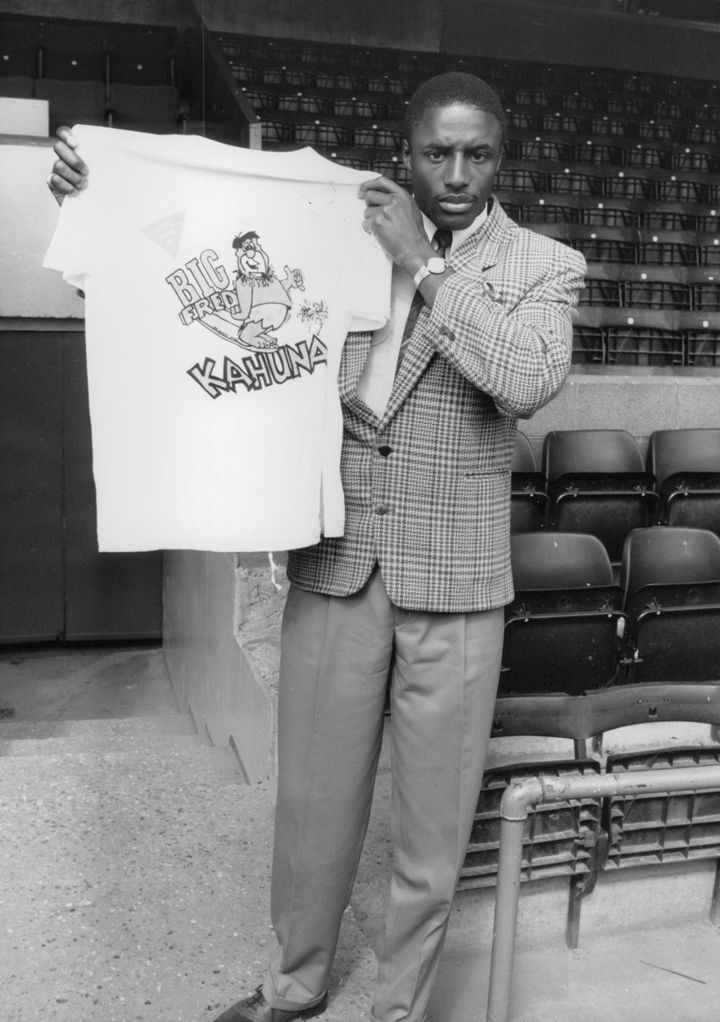 Footballer John Fashanu holding a t-shirt identical to the one Lee was wearing when he vanished 
