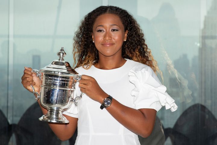 Naomi Osaka of Japan poses with the championship trophy