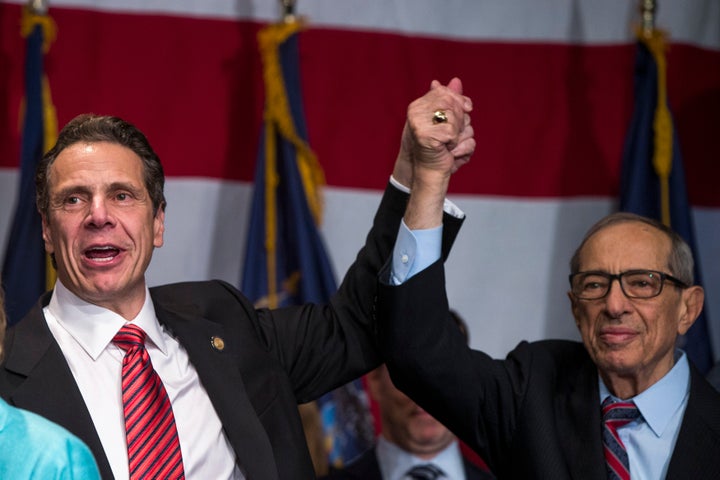 Democratic New York Gov. Andrew Cuomo (left) celebrates with his father, former Gov. Mario Cuomo, after winning a second term on Nov. 4, 2014.