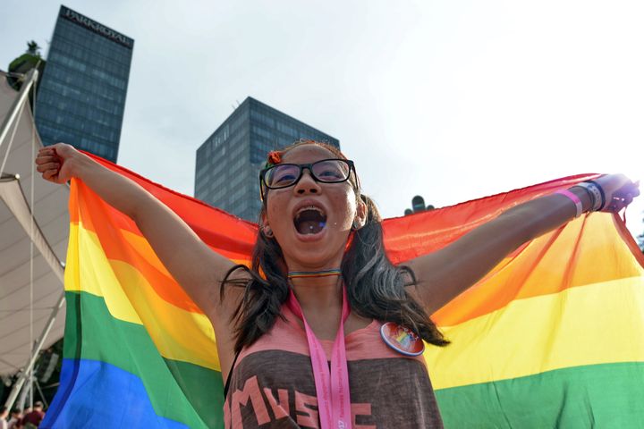 An online survey published Monday found that a slim majority of Singaporeans still support a law that bans gay sex. 