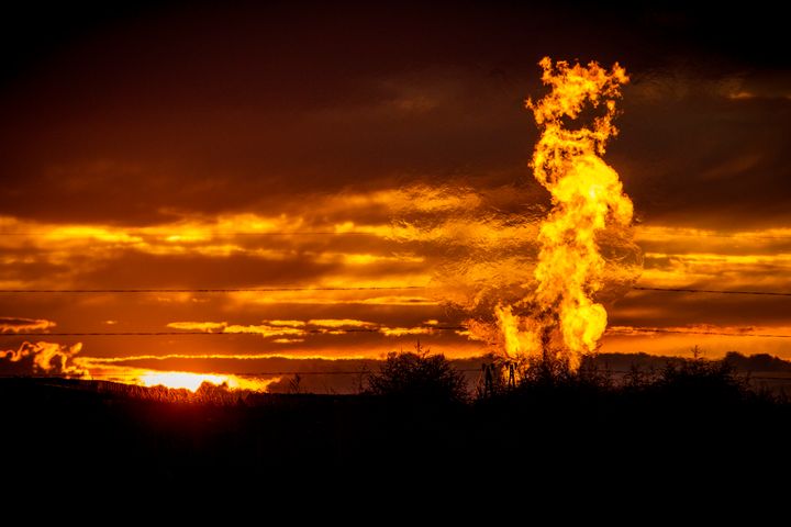 Flames from a flaring pit near a well in the Bakken oil field, which spans Montana, North Dakota and parts of Canada. The primary component of natural gas is methane.